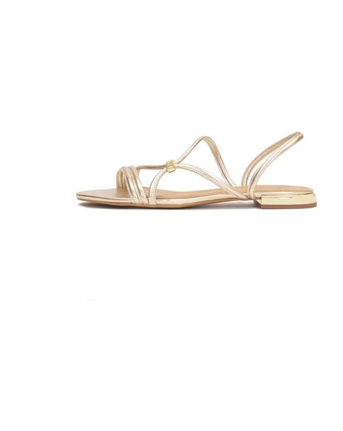 Goldene Pantoletten, die auch als Sandalen getragen werden können