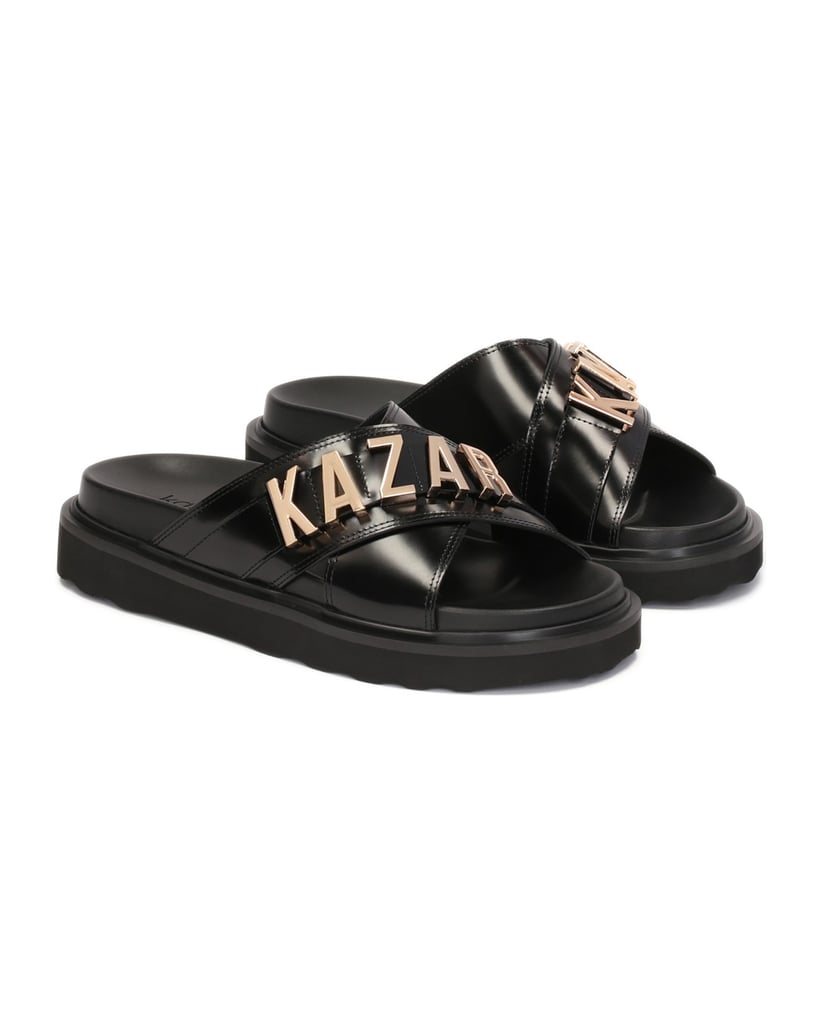 Kazar-Schwarze-Lederpantoletten-mit-Metallschriftzug-schwarz