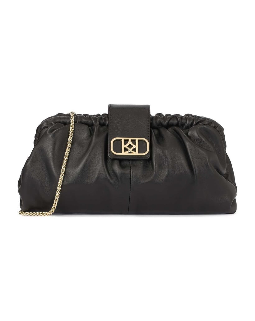Kazar-Schwarze-Clutch-Handtasche-mit-auffälligem-Logo-schwarz